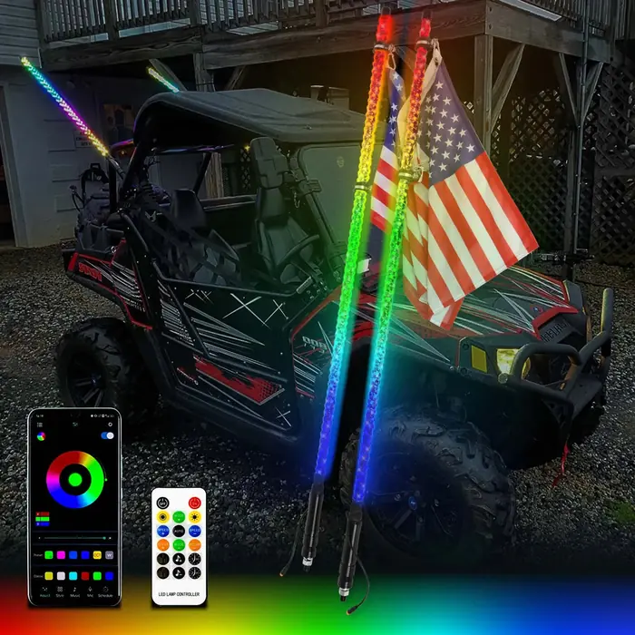 RGB LED whip lights mounted on a side-by-side at night